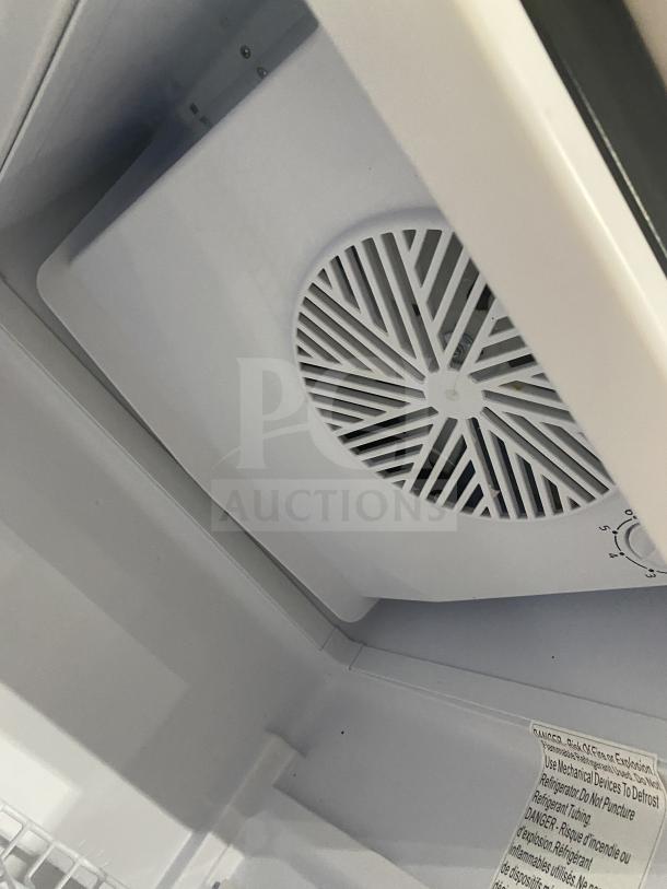 KoolMore MDR-9CP refrigerator interior, showing fan vent and control dial. Poly-coated wired rack visible below.