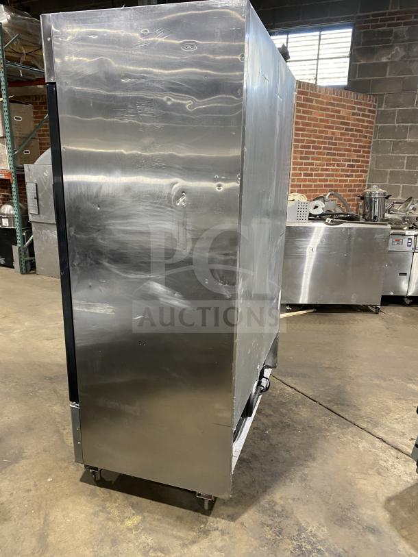 Atosa Series MCF8707 commercial stainless steel reach-in merchandiser fridge, double glass swing doors, on casters.