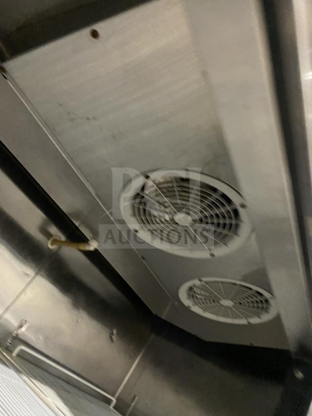 Interior view of Atosa MCF8707 commercial refrigerator showing dual fans and stainless steel surfaces.