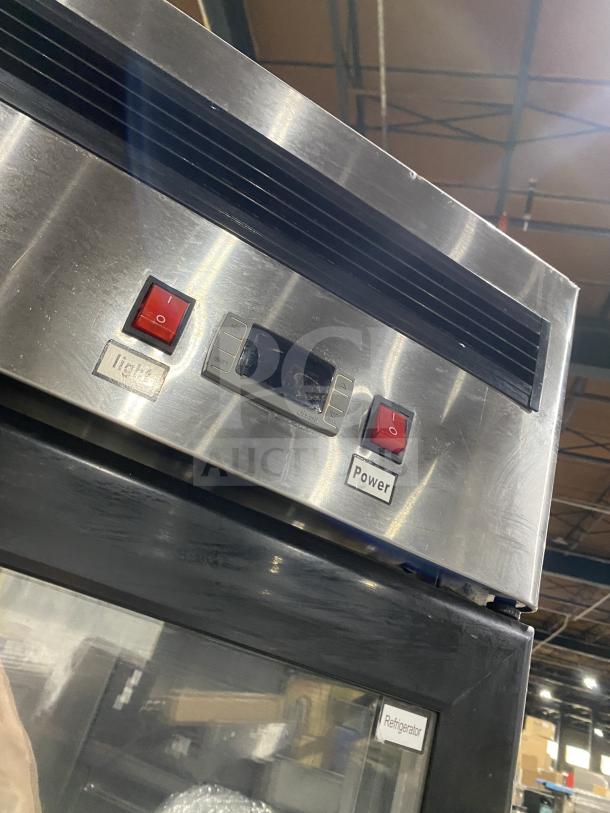 Atosa commercial stainless steel double glass door refrigerator, model MCF8707, with control panel and power switch visible.