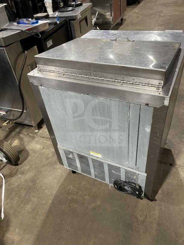 Beverage Air SP27 stainless steel refrigerated sandwich prep table, single door storage, 115V, on casters. Model serial 8108534.