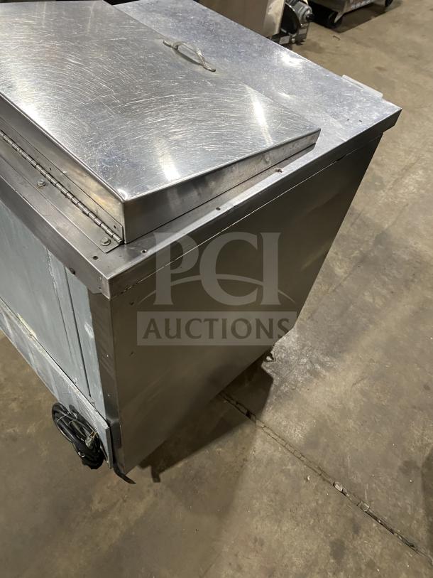 Beverage Air SP27 stainless steel refrigerated sandwich prep table with single door storage, on casters, 115V 1Phase.
