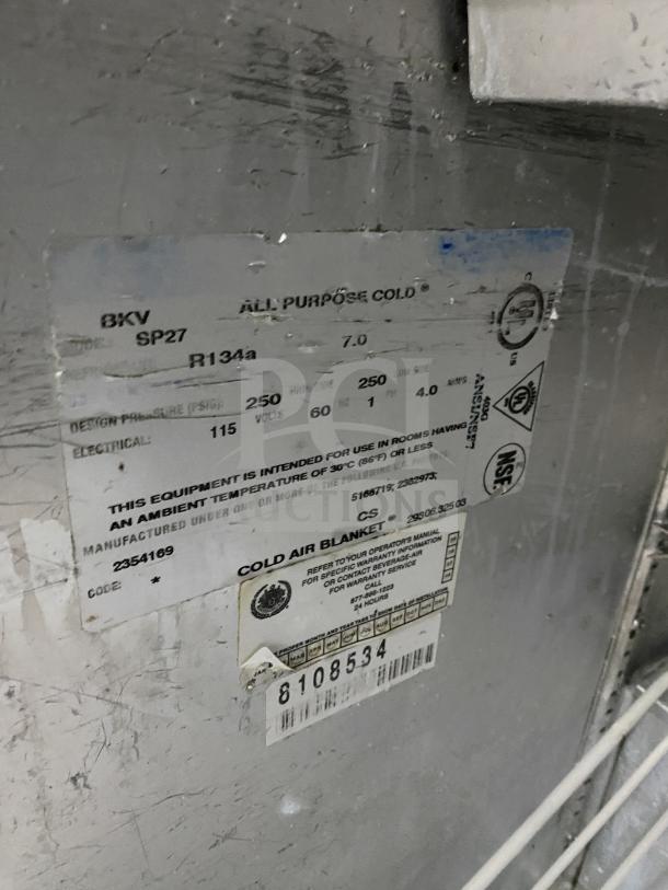 Beverage Air SP27 stainless steel prep table, single door storage, 115V, on casters, serial 8108534, NSF certified, refrigeration label shown.