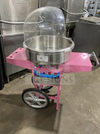 Olde Midway Spin-2000 pink cotton candy machine with 20" stainless bowl, bubble shield dome, on wheels and legs, Model SN: 5002274.