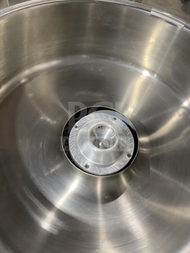 Olde Midway SN: 5002274 cotton candy machine's stainless steel bowl interior, showing central spinner.