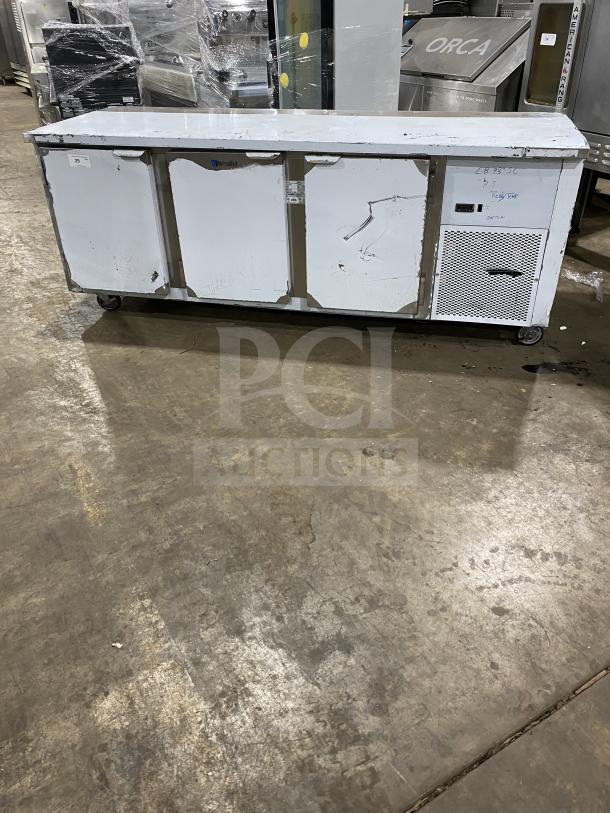 Customcool LB93SE stainless steel white prep table with refrigeration, on casters, 115V 1-phase, SN: B2018080. Good condition.