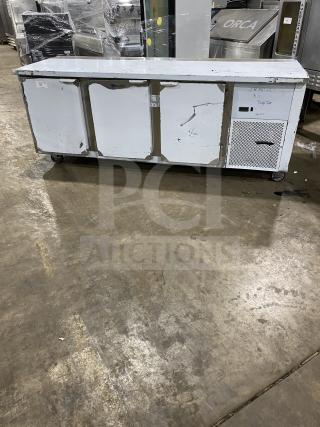 Customcool LB93SE stainless steel white prep table with refrigeration, on casters, 115V 1-phase, SN: B2018080. Good condition.