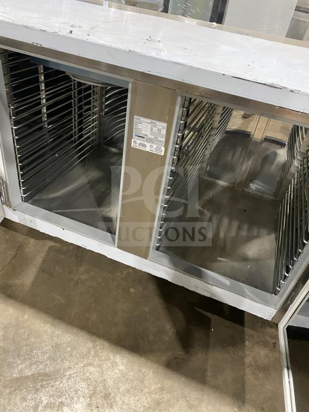 Customcool LB93SE stainless steel white prep table with refrigeration, on casters. Good condition, 115V 1 phase, SN: B2018080.