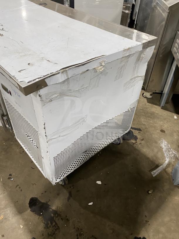 Customcool Commercial Stainless Steel White Prep Table with refrigeration, Model LB93SE, on casters, 115V 1 Phase, moderate wear.