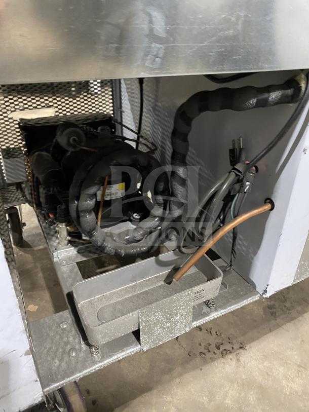 Customcool LB93SE stainless steel white refrigerated prep table, on casters, 115V 1 Phase. Visible internal components.