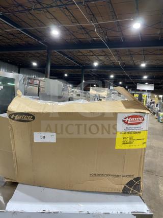 New Hatco GRFFB Glo-Ray Series Commercial Food Warmer in box, stainless steel, with overhead heating strip, 120V, 1 Phase.