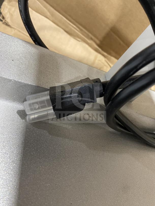 Hatco GRFFB Glo-Ray stainless steel countertop food warmer with overhead heating strip, new in box, 120V, electric cord shown.