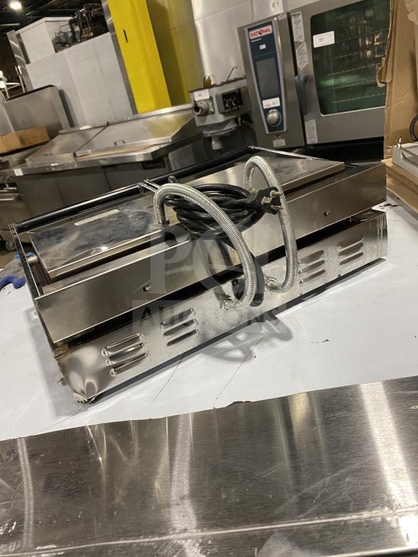Ceciware TSG-2G commercial electric double panini press, 230V, stainless steel, model SN 1604G02495, shown with power cord.