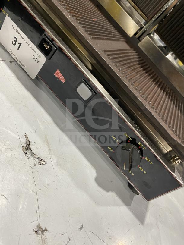 Ceciware TSG-2G commercial electric double panini press, temperature control dial, model and serial tags visible.