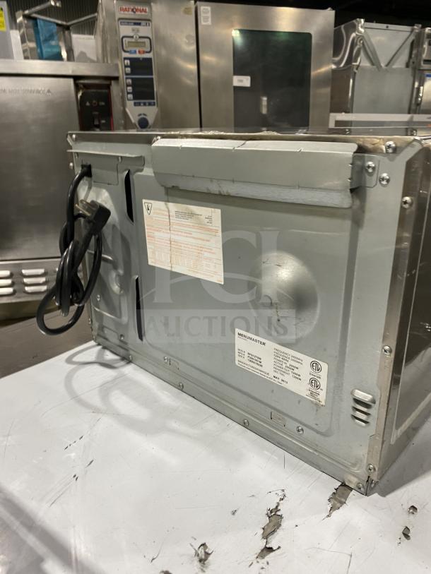 Menumaster RFS12TSW commercial microwave oven, stainless steel, digital push button control, 120V. Visible power cord and label.