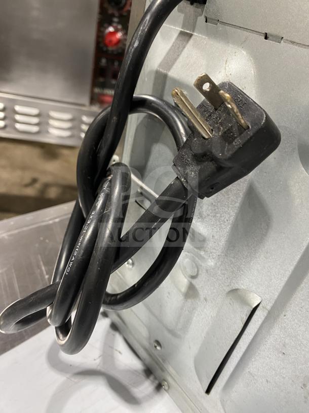 Menumaster RFS12TSW commercial stainless steel microwave with digital controls, electric cord shown, 120V.