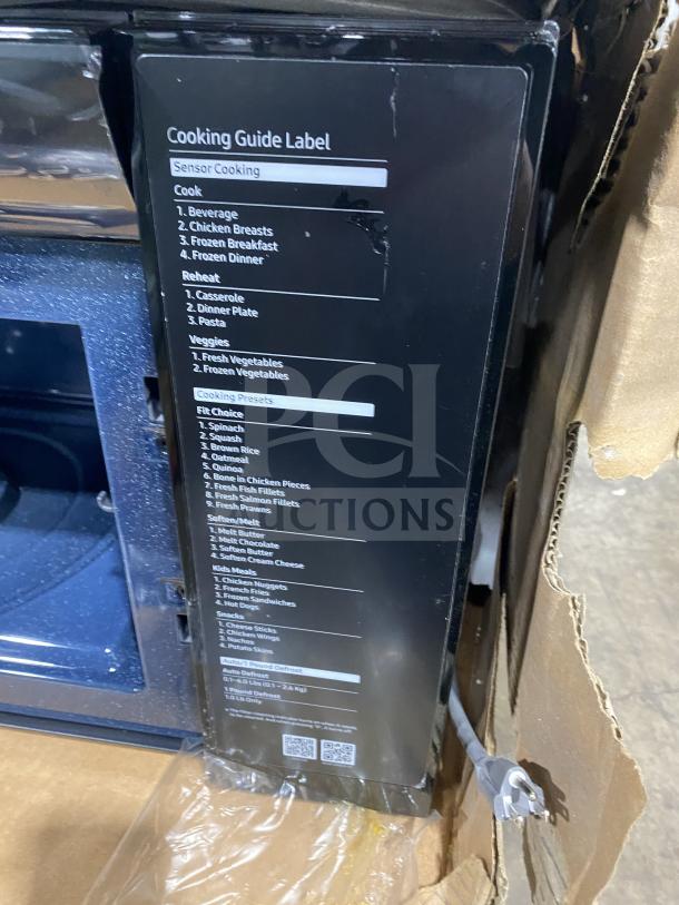 New Samsung Commercial Stainless Steel Countertop Microwave Oven, Model ME213706BAG, with cooking guide label.