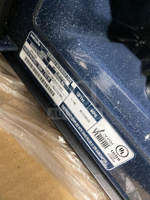 New Samsung ME213706BAG stainless steel commercial countertop microwave, 120V, mint condition, with compliance and UL label visible.