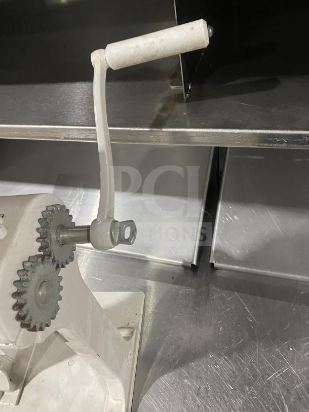 Wow! Rcomb commercial manual heavy-duty meat cuber and tenderizer machine with sturdy metal gears and hand crank.