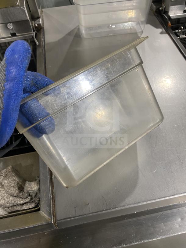 Clear polycarbonate food pan, commercial use, sturdy design, gently used condition, approximate dimensions 7x.