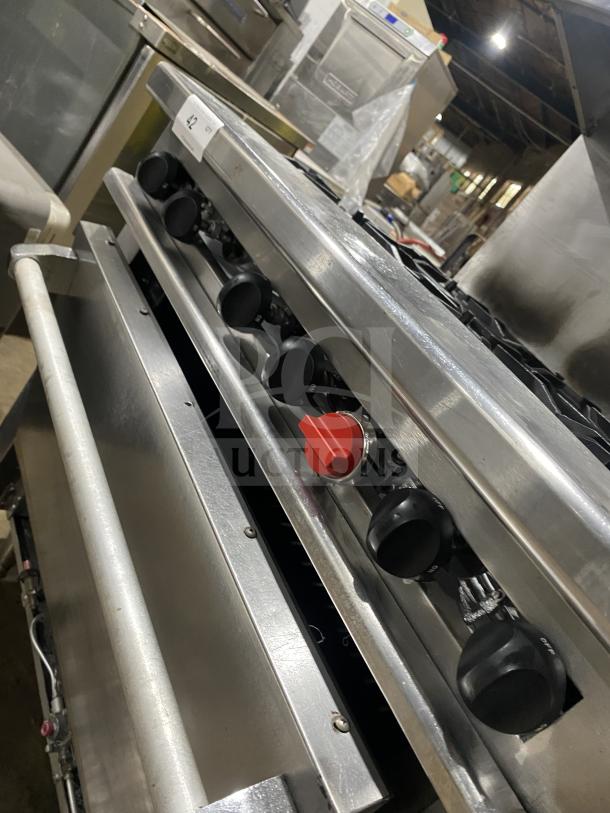 Therma-Tek commercial stainless steel 6-burner gas range, featuring control knobs and robust build. Ideal for professional kitchens.