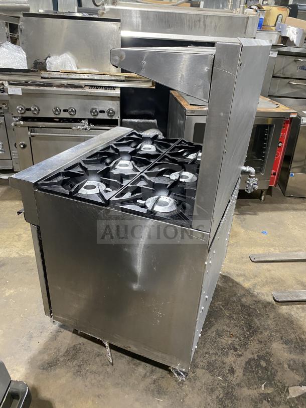 Therma-Tek commercial stainless steel 6 burner range, natural gas powered, fair condition, visible wear on the sides.