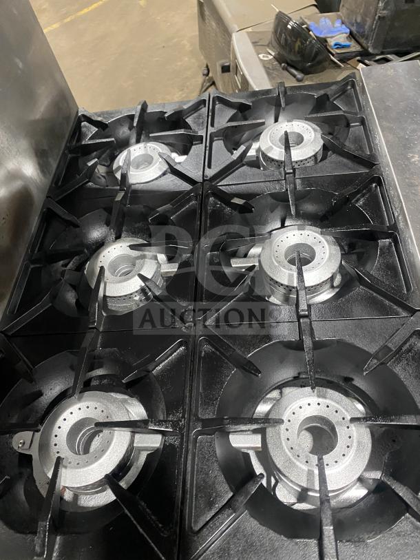 Therma-Tek stainless steel 6-burner commercial range, natural gas powered, in good condition.