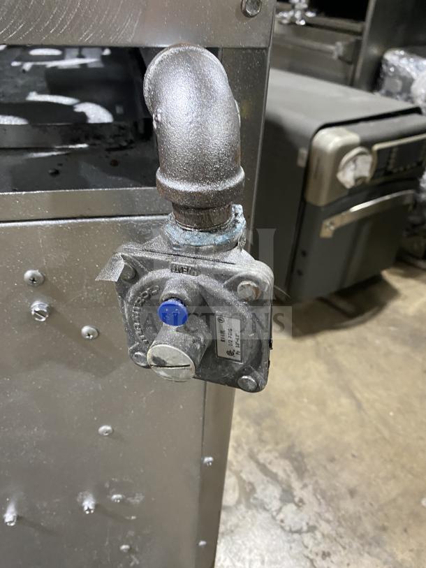 Therma-Tek 6 burner stainless steel natural gas range, commercial grade, detailed view showing gas pipe connection.