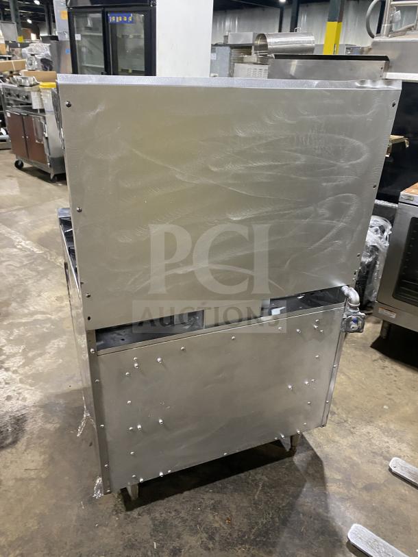 Therma-Tek 6-burner stainless steel range, natural gas powered, commercial-grade, rear view, sturdy design, used condition.