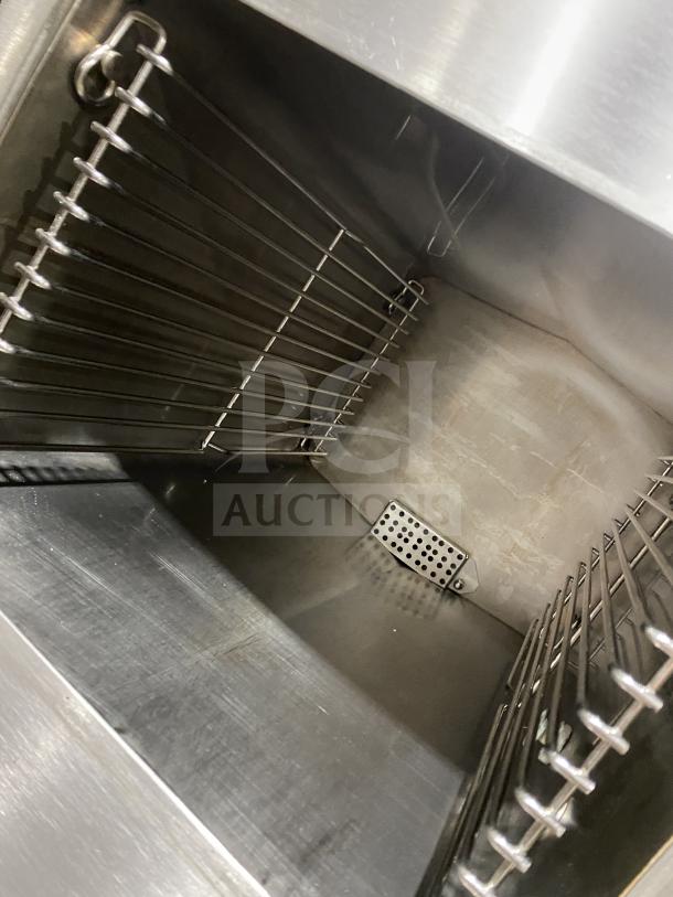 Cleveland 24CEM24 stainless steel convection steamer interior, featuring dual compartments and sturdy wire racks.