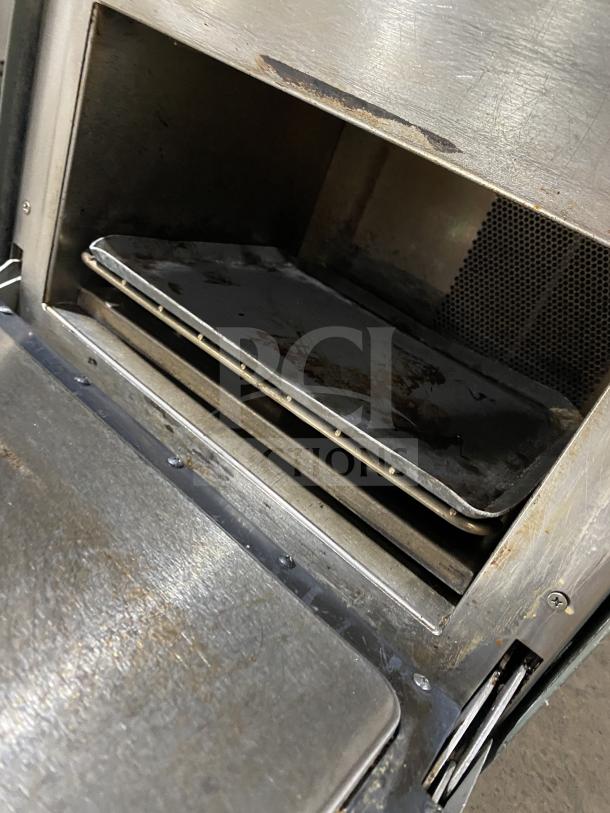 TurboChef NGO commercial rapid cook turbo oven interior, showing metal racks and stainless steel finish. Uses 208/240 V, 1 Phase.