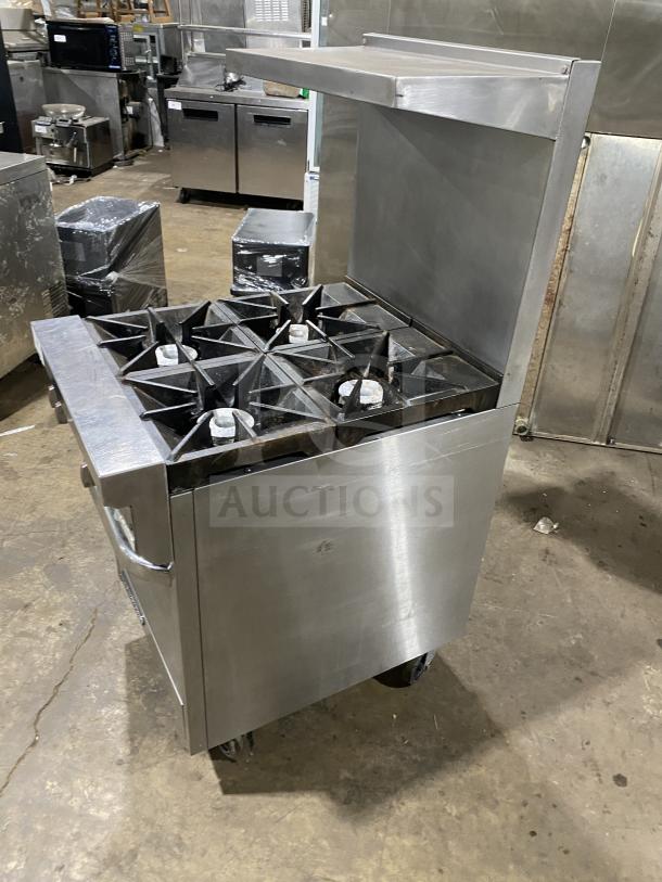 Southbend S241E stainless steel 4-burner range/oven combo with backsplash and overhead; on casters; natural gas-powered.