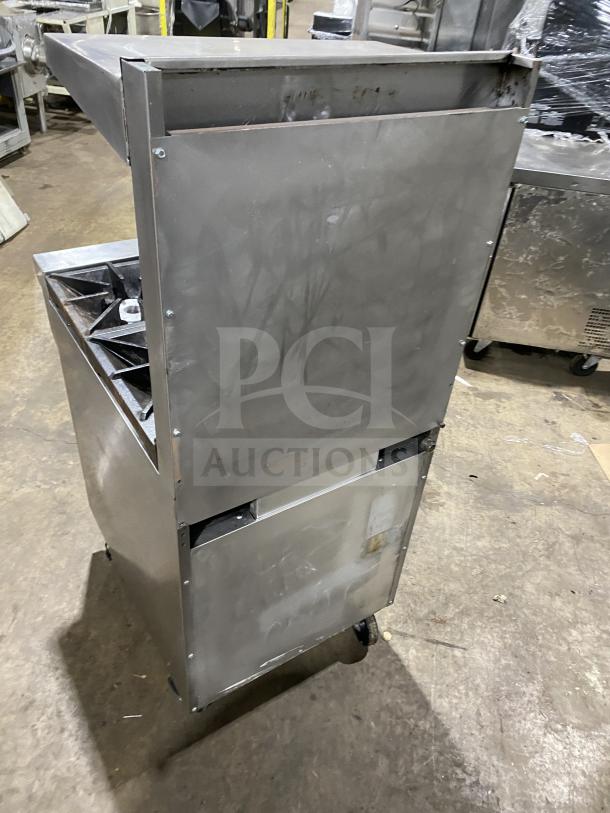 Southbend S241E commercial 4-burner stainless steel range/oven combo. Natural gas, includes backsplash, overhead, and wired oven rack. On casters.