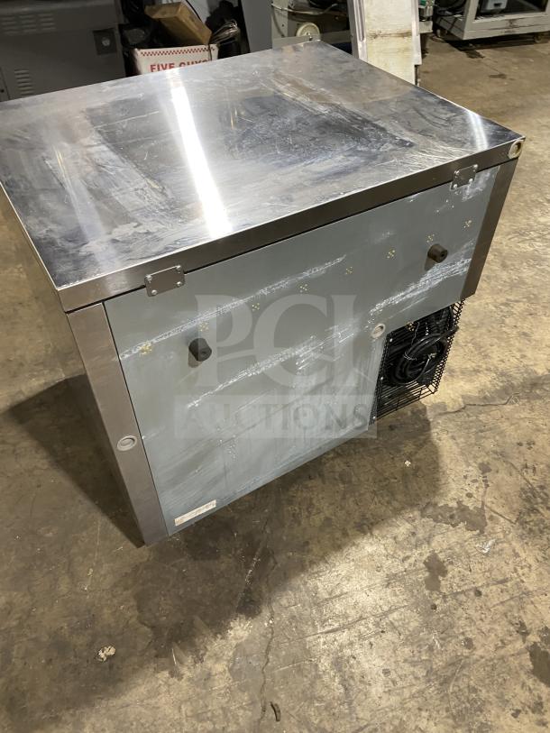 Turbo Air JUR-36 stainless steel undercounter refrigerator with side-mounted compressor, includes poly-coated wired rack.