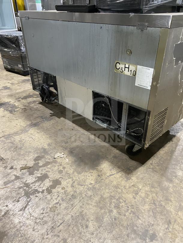 Migali 2-Door Stainless Steel Undercounter Refrigerator, Model C-U60R-HC, on casters, includes poly coated wired rack.