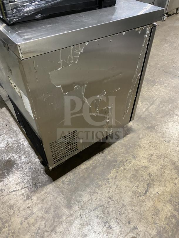 Migali 2-door stainless steel undercounter refrigerator, model C-U60R-HC. On casters, with poly-coated wired rack, 115V, 1 phase.