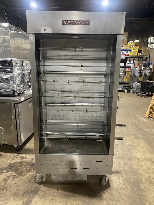 Attias stainless steel gas-powered rotisserie cabinet on casters, full-height, commercial-grade, excellent condition.