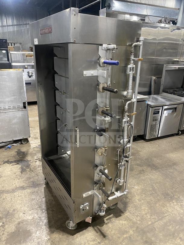 Attias Commercial Stainless Steel Gas Rotisserie Cabinet on casters, full-height, good condition, industrial setting.