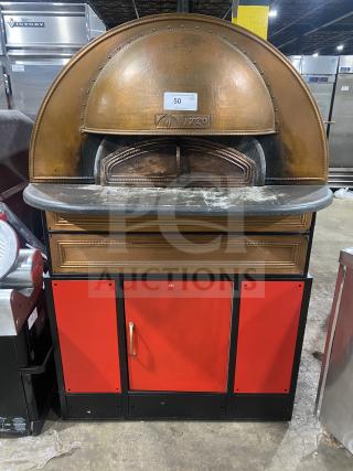 Izzo Forni red electric dome-style pizza oven in good condition, with wooden pizza paddle included; features distinctive branding.