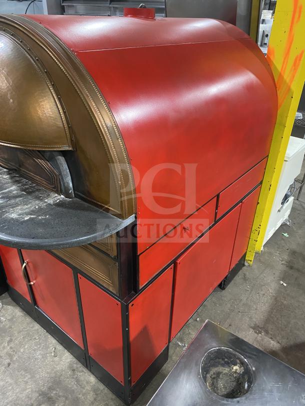 Izzo Forni red electric dome-style pizza oven, commercial use, includes wooden pizza paddle, excellent condition.