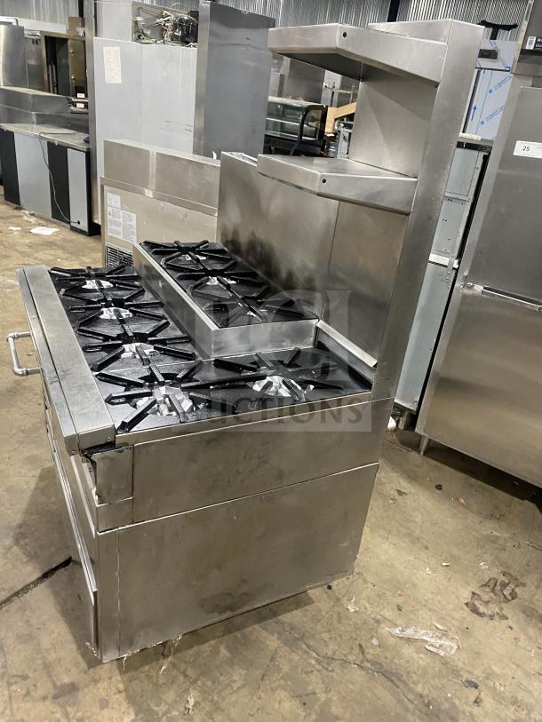 Jade Range 8-burner stainless steel commercial range with 2-drawer chef base, back splash, and flue riser. Model TRLH-02S-T-48.