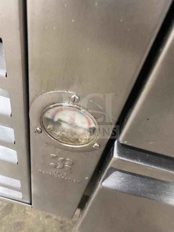 Jade Range stainless steel 8-burner commercial range, Model TRLH-02S-T-48, with drawer base, backsplash, and flue riser, used.