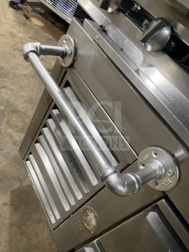 Jade Range Model TRLH-02S-T-48; stainless steel; 8-burner; natural gas; chef base; back splash; flue riser; on legs.