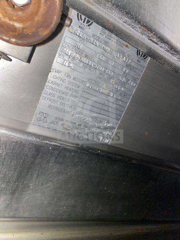 Close-up of the manufacturer's label on a Jade model TRLH-02S-T-48 commercial range. Details serial number and specifications.