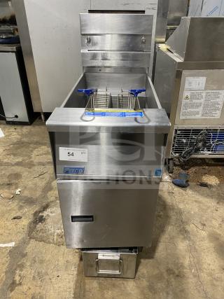 Pitco SFSG14 commercial stainless steel gas deep fat fryer with backsplash, basket hanger, and fry basket; on casters.
