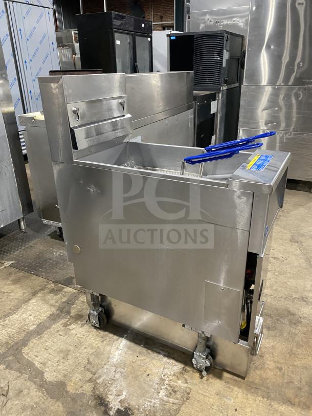 Pitco SFSG14 stainless steel gas fryer with backsplash, basket hanger, fry basket, and casters. Model: SFSG14 SN: G12MCO60863.