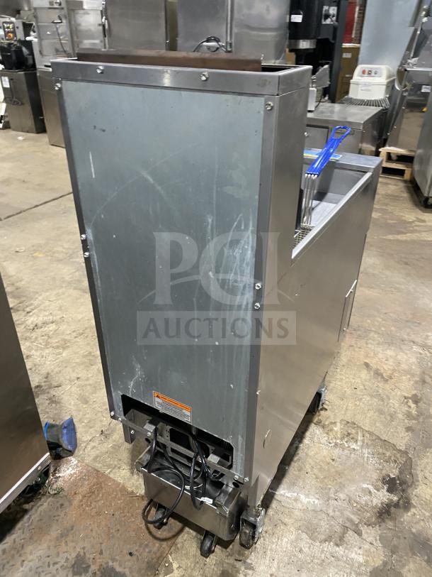 Pitco SFSG14 stainless steel gas fryer on casters, with backsplash, basket hanger, and included fry basket.