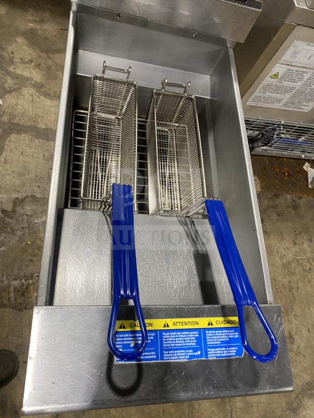 Pitco Commercial Stainless Steel Gas Fryer SFSG14, includes backsplash, basket hanger, fry basket, and casters, in used condition.