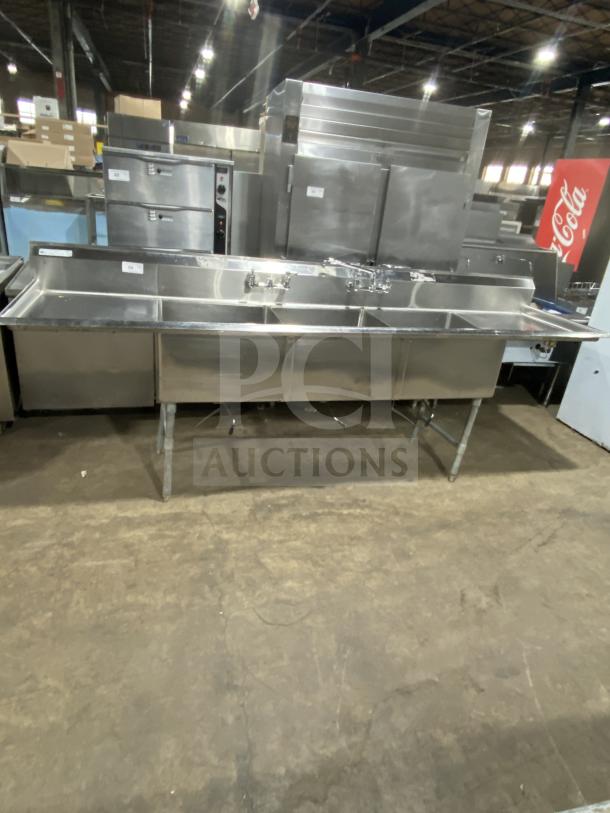 Stainless steel 3-compartment sink by KCS, commercial-grade, on legs, excellent condition, with integrated faucets.