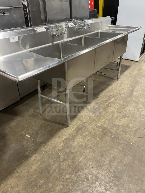 KCS commercial stainless steel 3-compartment sink on legs, in good condition, featuring faucets and a sturdy design.